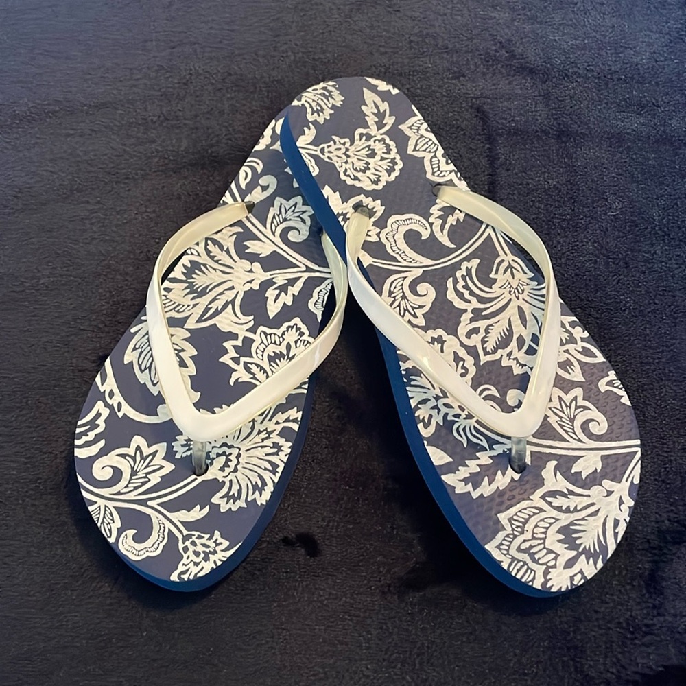 Woman’s navy flip flops